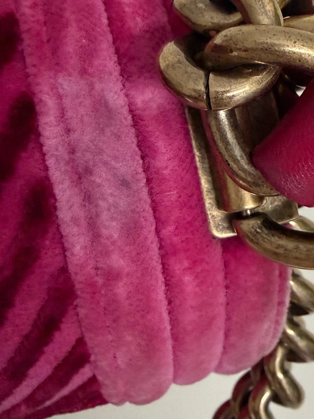 Chanel Boy Flap Bag in pink velvet with chevron quilting and gold-tone hardware.